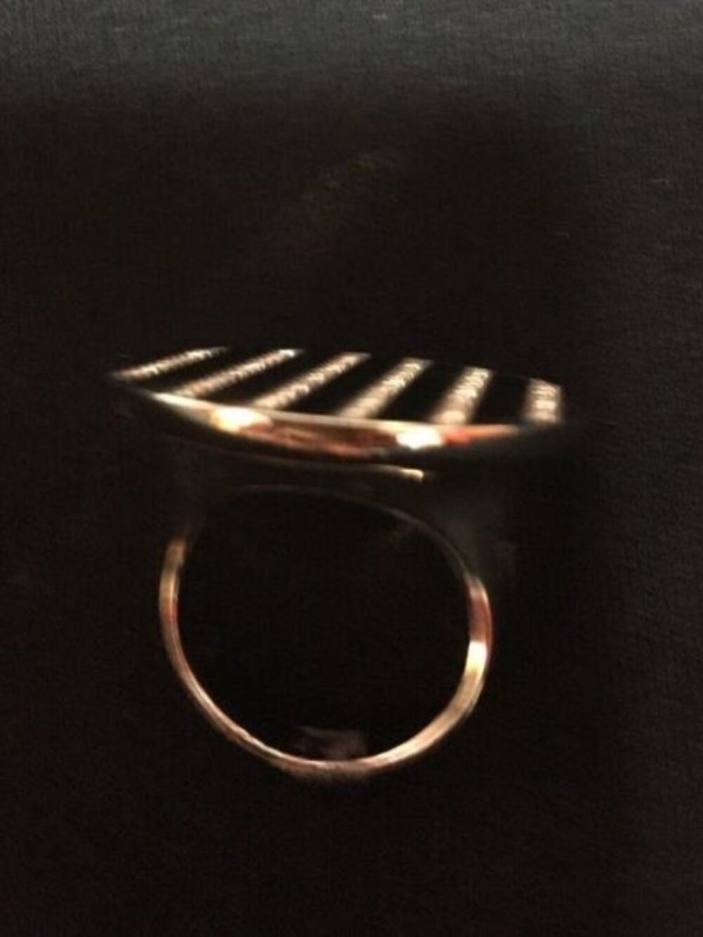 Black and silver ring with rhinestones.